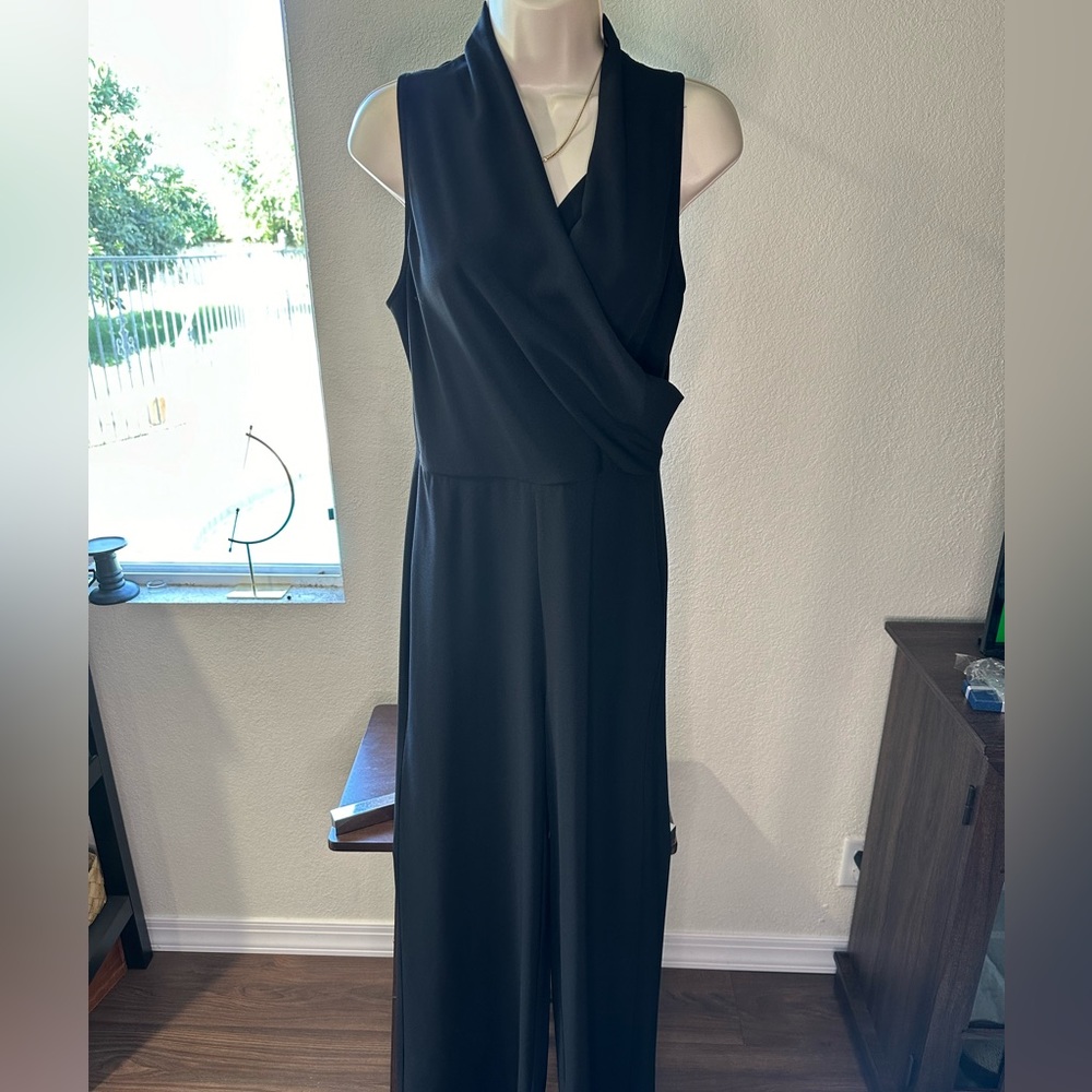 cupcakes and cashmere Black jumpsuit. Wide leg, wrap top. Great for any event!